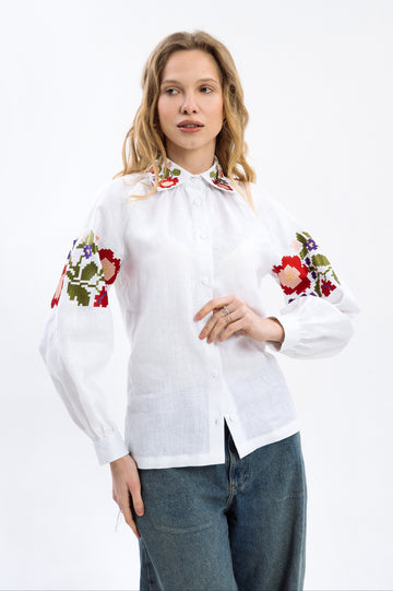 Біла блузка з льону з кольоровою вишивкою