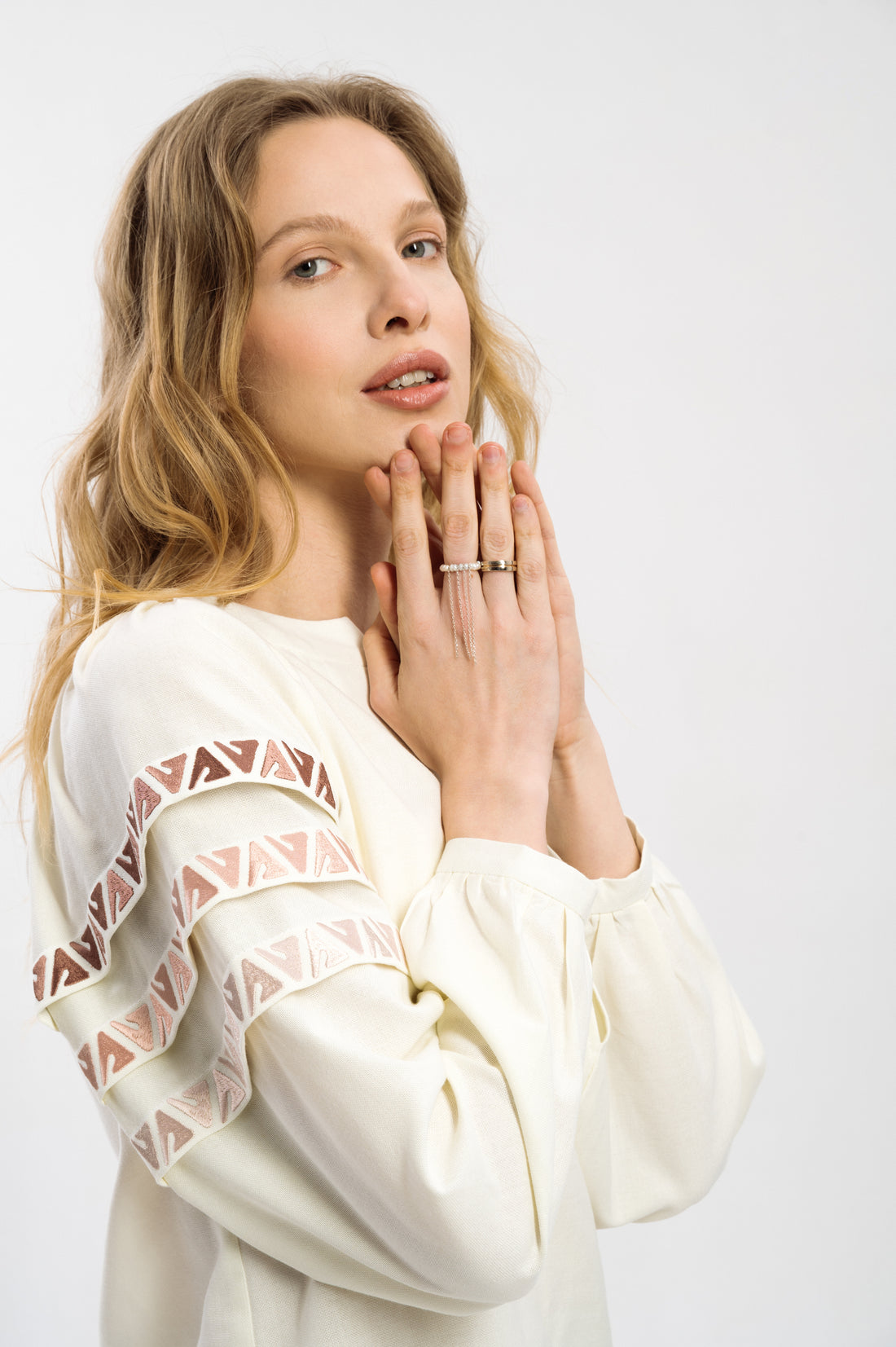 Elegant Cream-Colored Blouse With Ethnic Accents On The Sleeves