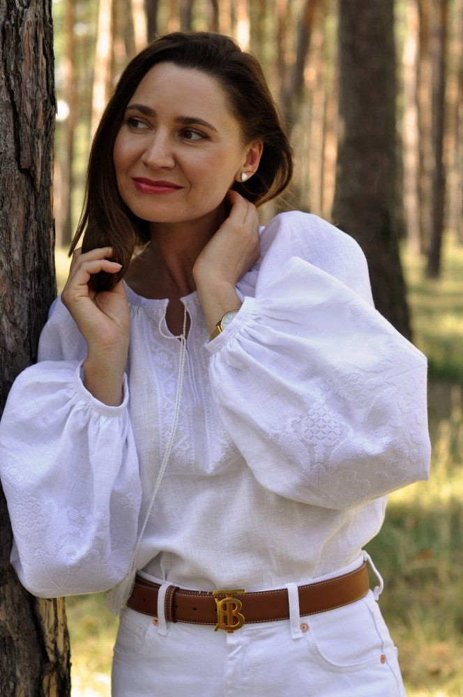 Women's Embroidered Shirt With Elegant Volumetric White Embroidery On A White Background