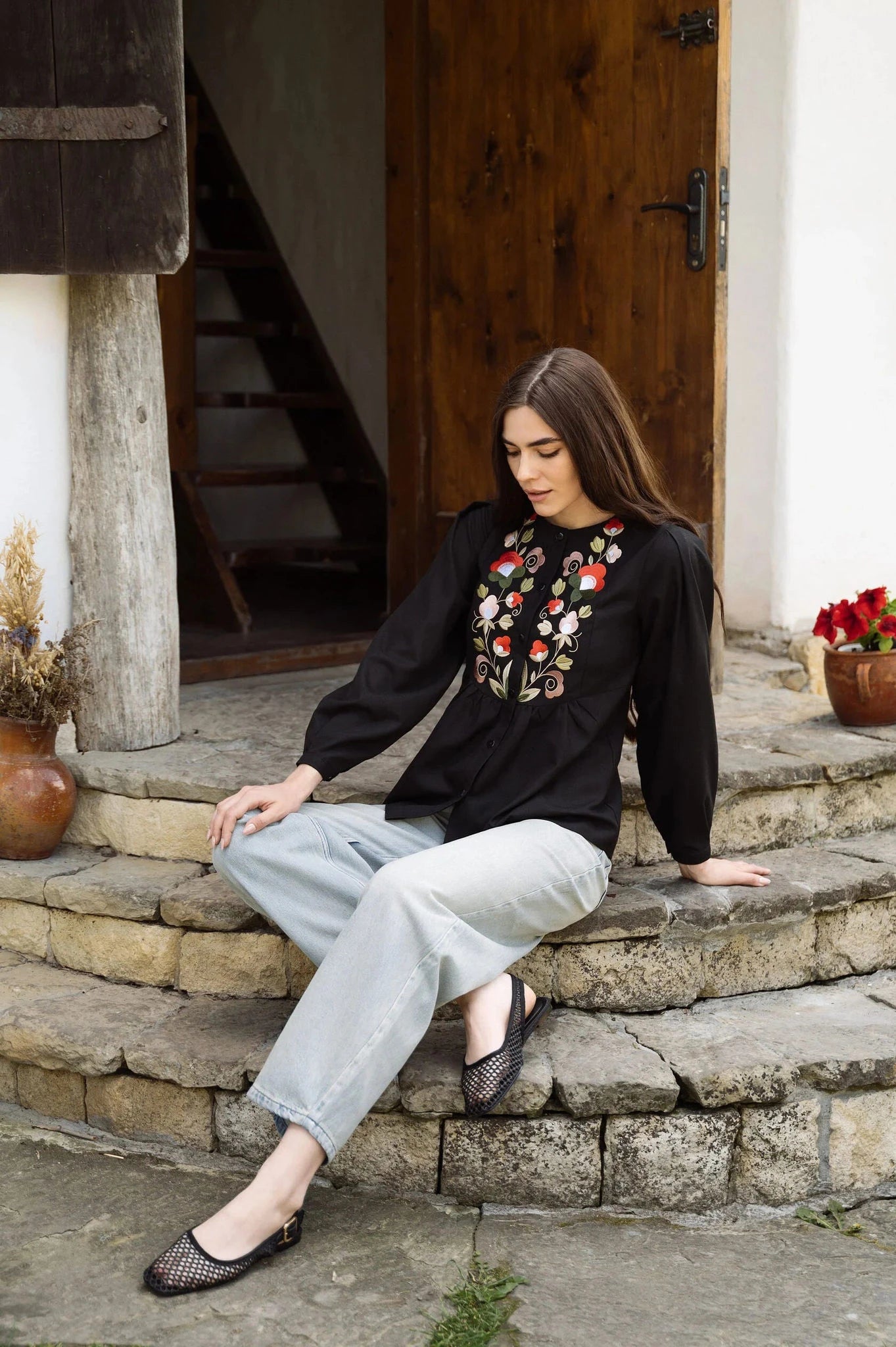 Black Blouse With Delicate Pastel Embroidery And Decorative Buttons Ornament