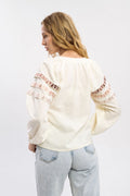 Elegant Cream-Colored Blouse With Ethnic Accents On The Sleeves Ornament