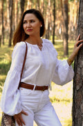 Women's Embroidered Blouse With Elegant Volumetric White Embroidery On A White Background Ornament