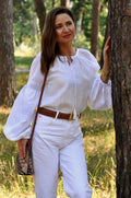 Women's Embroidered Blouse With Elegant Volumetric White Embroidery On A White Background Ornament